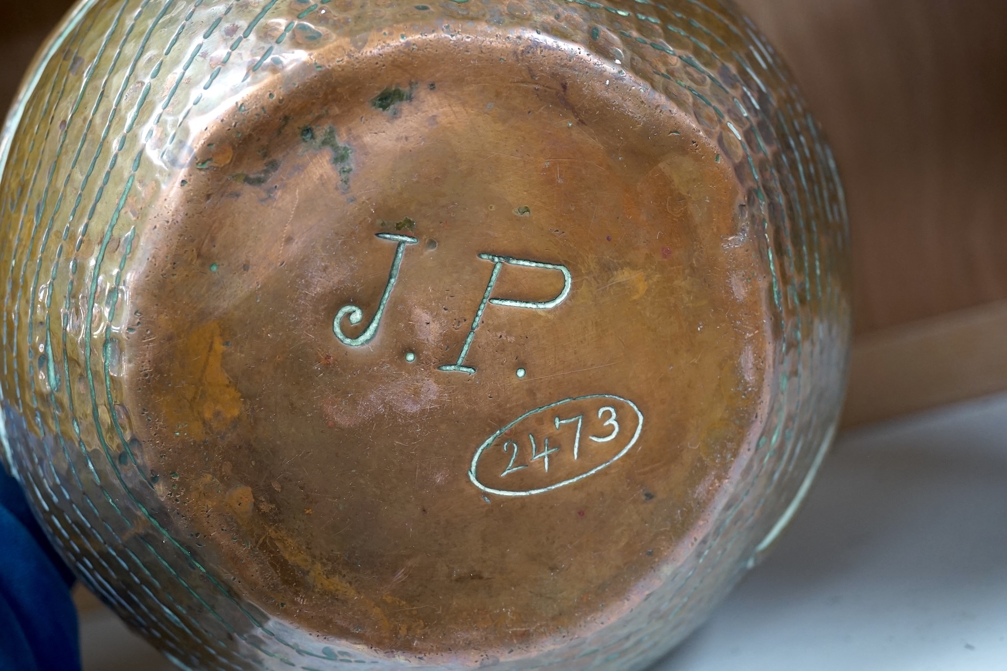 A Newlyn Arts & Crafts jardiniere by John Pearson, decorated with four different fish, signed and numbered 2473. Condition - minor dents, essentially good